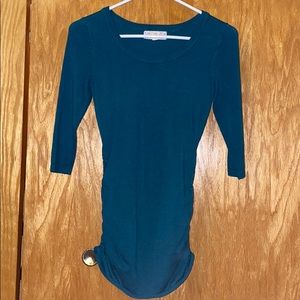 green, long sleeve sweater with gathered sides